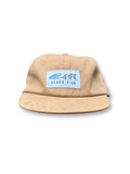 beige cotton hat with mountain-wave woven patch