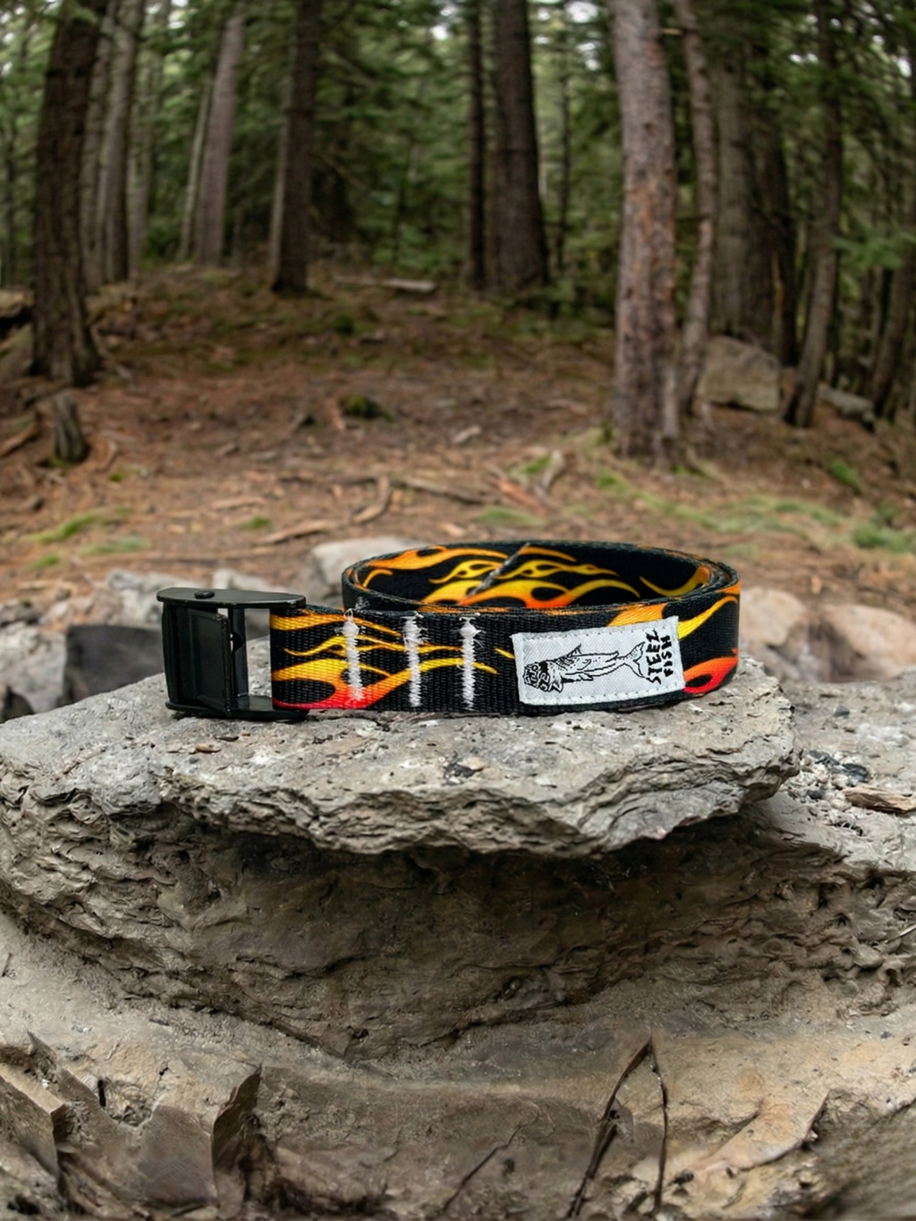 flame patterned cam strap belt in the woods 